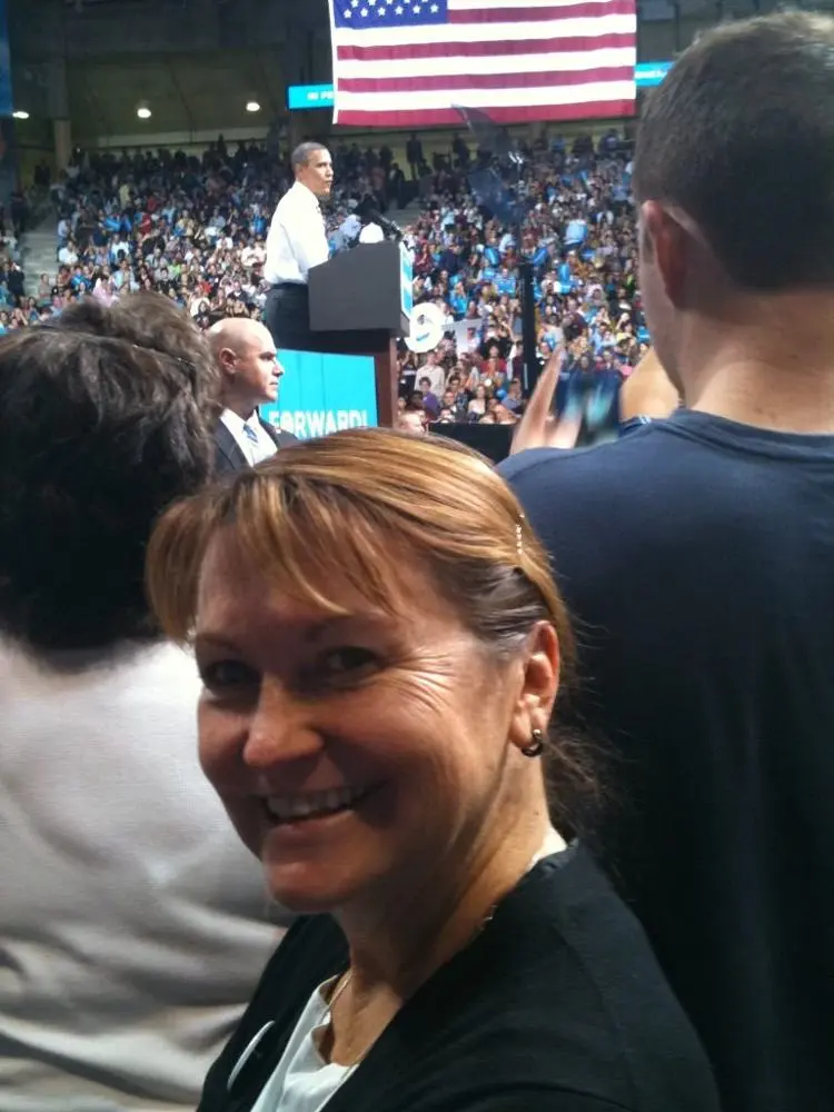 Val's mom smiling up front at a 2012 Obama rally